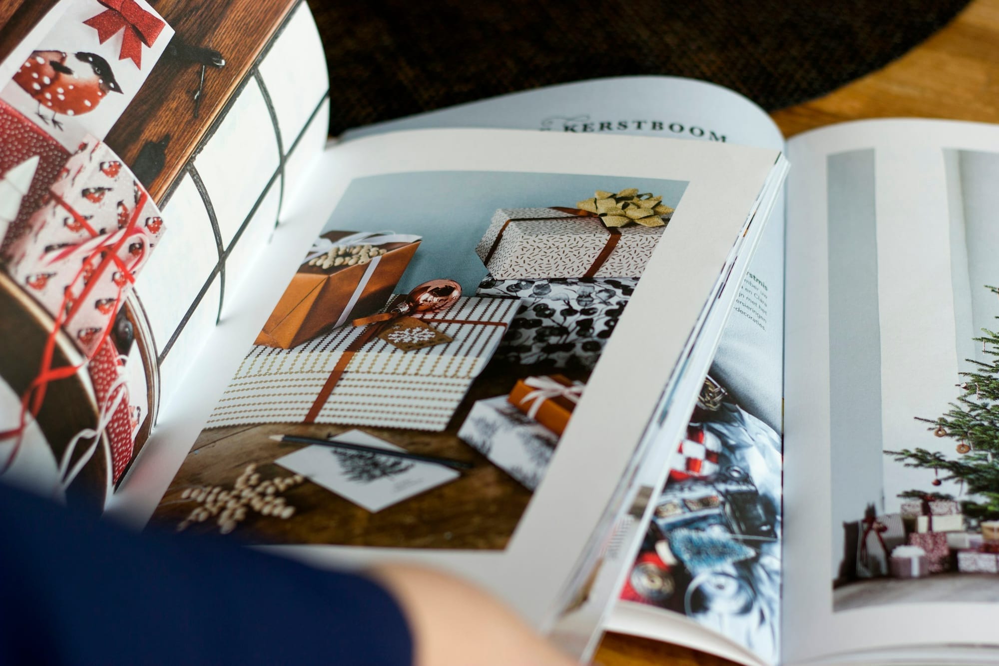 An open seasonal magazine displaying a photographed gift layout.