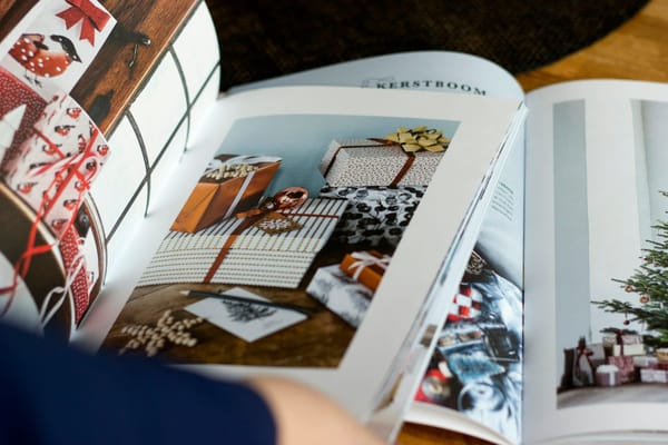 An open seasonal magazine displaying a photographed gift layout.